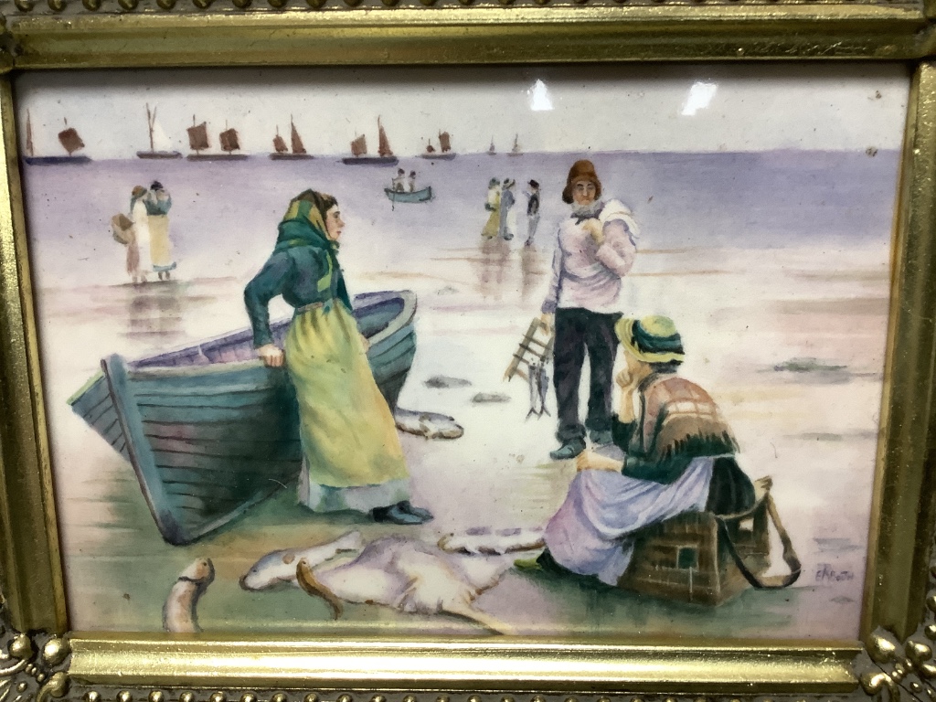 A framed porcelain plaque, painted by E.R. Booth, depicting fisherwomen at the shore, 12 x 17cm excluding frame